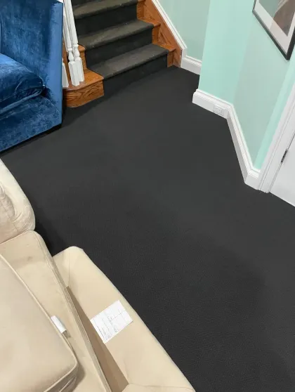 Charcoal carpet installed in a basement family room and stairway