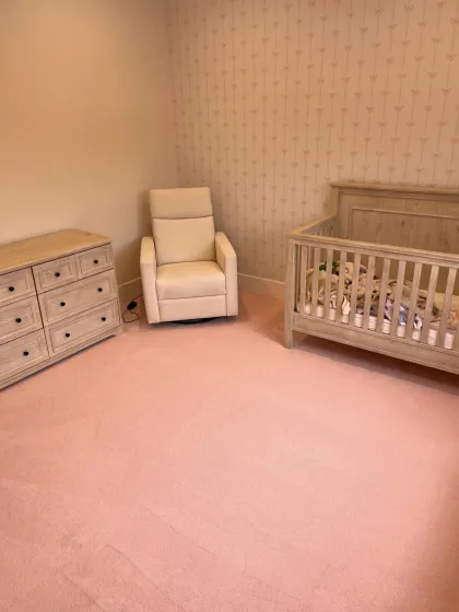 Soft pink carpet installed in a nursery
