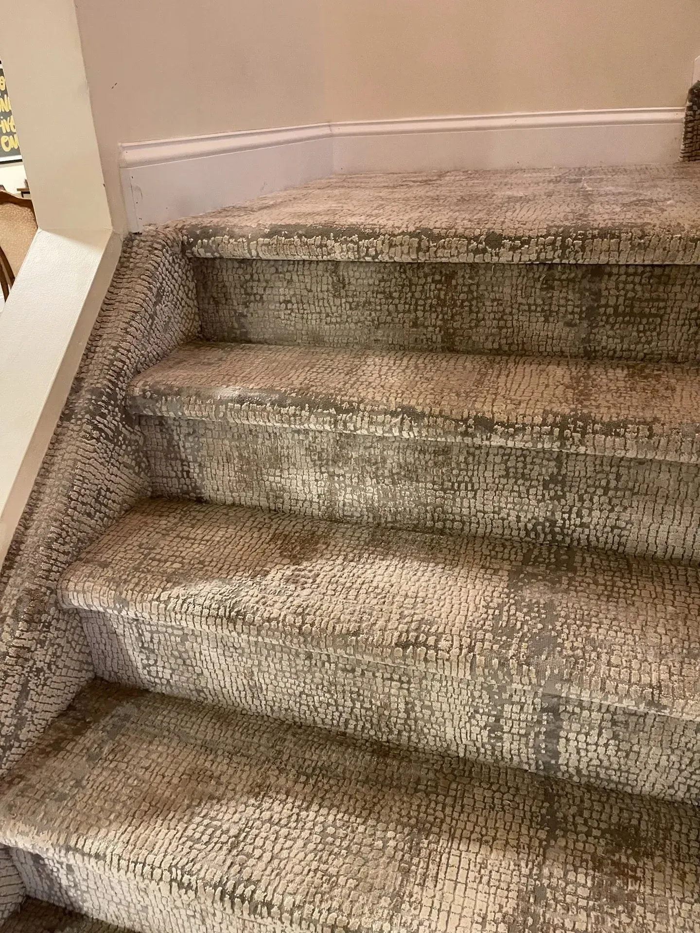 Textured grey carpet installed on staircase treads and risers