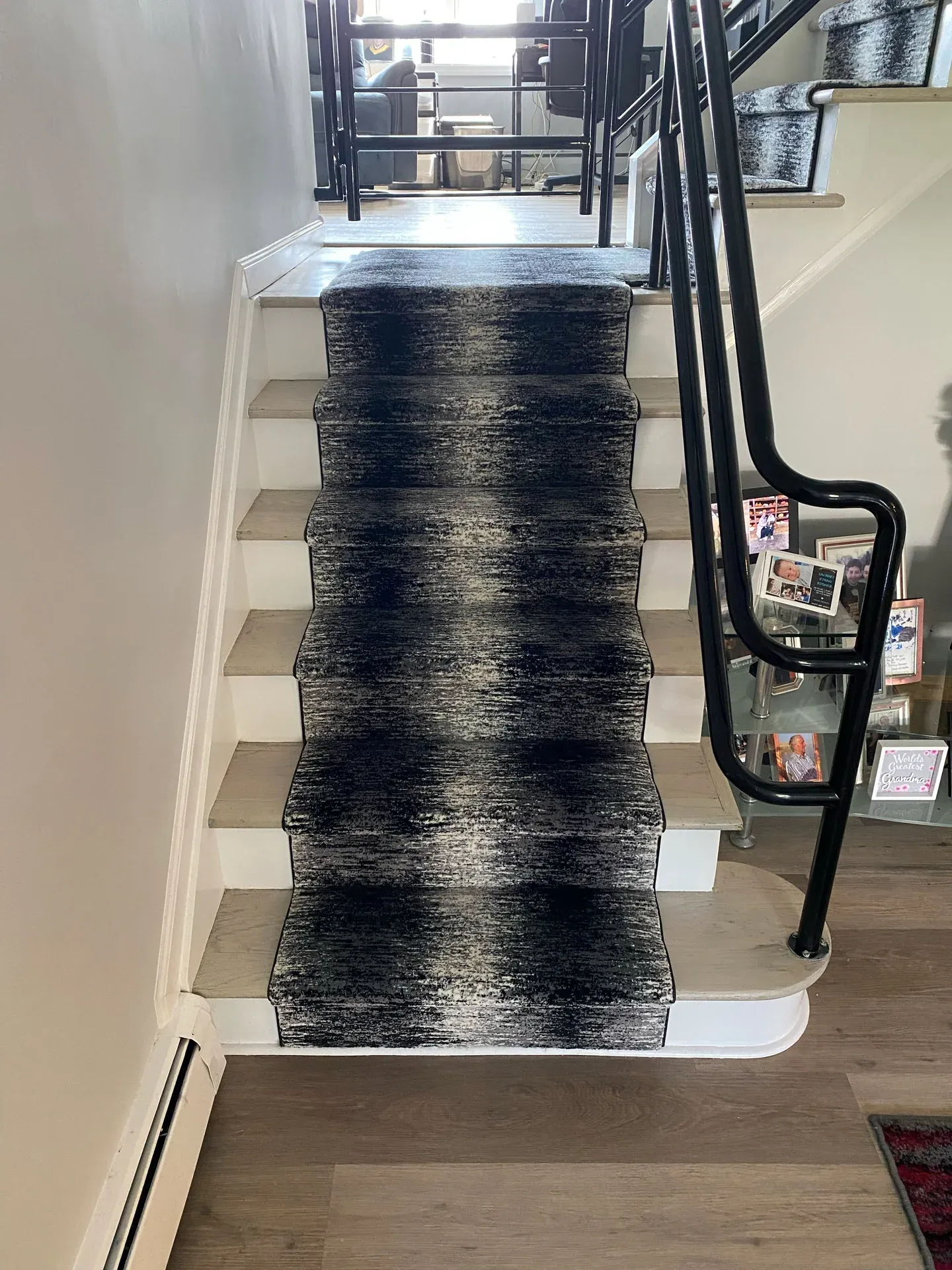 Modern abstract stair runner with a coordinating landing rug