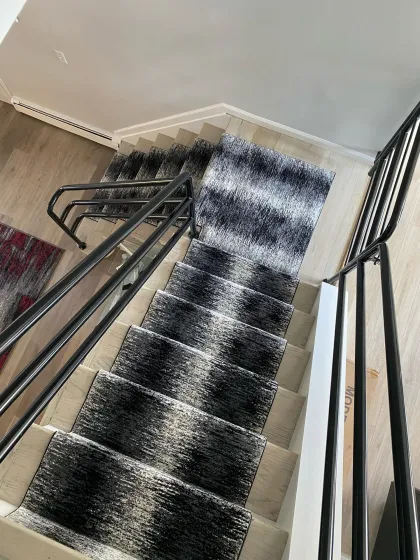Navy and cream abstract stair runner viewed from the landing