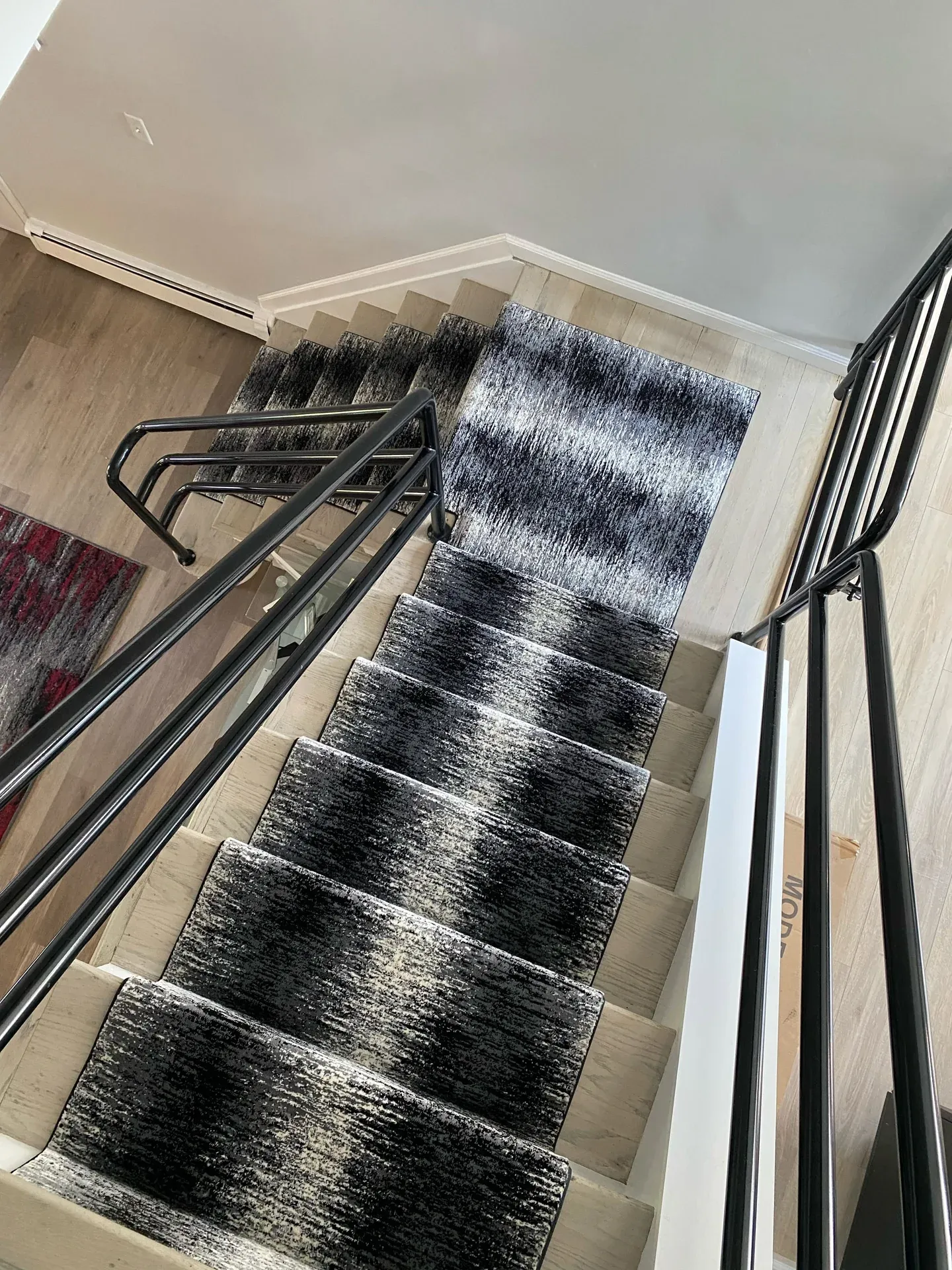 Navy and cream abstract stair runner viewed from the landing